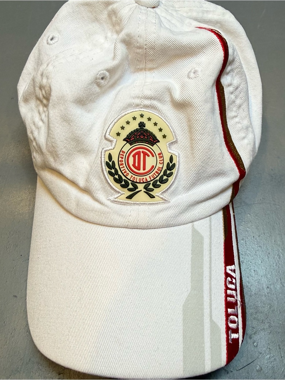Toluca White Baseball Cap with Red Trim and Club Crest